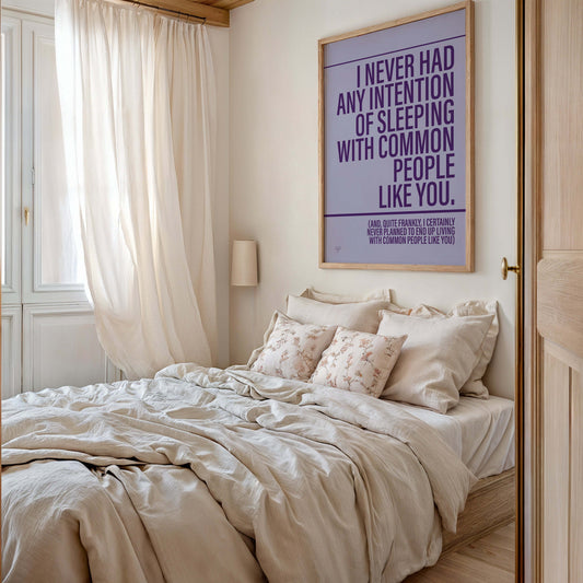 Colorful bedroom wall with awesome art prints displayed above bed